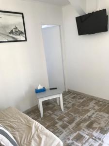 TV a/nebo společenská místnost v ubytování Gîte La Croix La grise + 6 fotografií