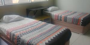 Voodi või voodid majutusasutuse Seaboard Hotel & Holiday Apartments toas