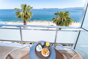 a plate of food on a table on a cruise ship at Avra Hotel in Methana