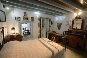 Katil atau katil-katil dalam bilik di Old Traditional House