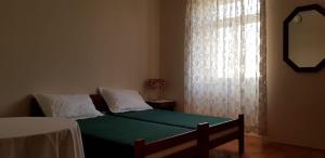Postel nebo postele na pokoji v ubytování Sobe Zeneral
