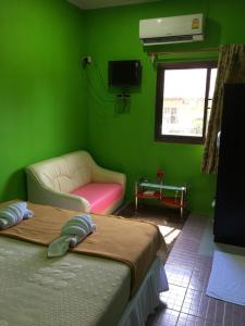 Postel nebo postele na pokoji v ubytování Hero Phuket