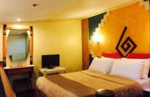 Postel nebo postele na pokoji v ubytování Urban Travellers Hotel