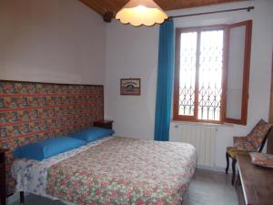 
A bed or beds in a room at La Vecchia Locanda
