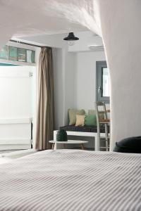 Łóżko lub łóżka w pokoju w obiekcie Terra Mare Suites