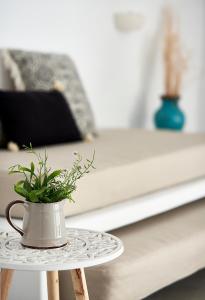Łóżko lub łóżka w pokoju w obiekcie Terra Mare Suites