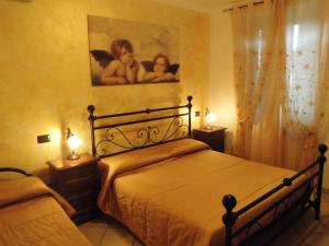 A bed or beds in a room at Il Casale Della Fornace