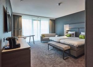 Postel nebo postele na pokoji v ubytování Van der Valk Hotel Leeuwarden