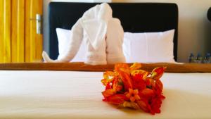 Postel nebo postele na pokoji v ubytování Rivonway Hotel Polonnaruwa