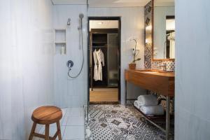 a bathroom with a sink, toilet and bathtub at Away Bali Legian Camakila Resort in Legian