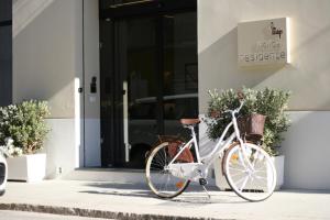 a bike parked in front of a building at Map holiday residence in Trapani