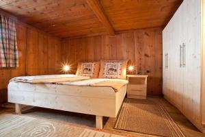 Ein Bett oder Betten in einem Zimmer der Unterkunft Berghütte Schöpf