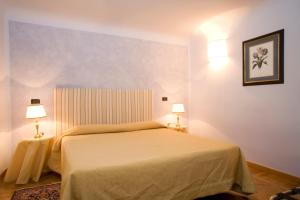 Posteľ alebo postele v izbe v ubytovaní Palazzo Gamba Apartments al Duomo