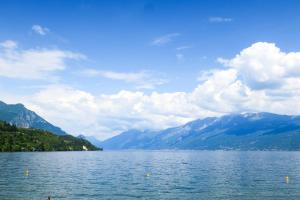 a view of a lake with mountains in the background at Appartamento A due passi dal lago in Toscolano Maderno