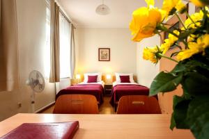 Posteľ alebo postele v izbe v ubytovaní Mały Kraków Aparthotel