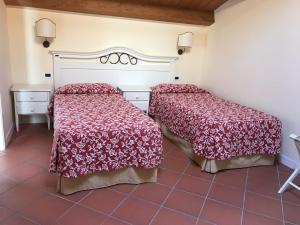 Кровать или кровати в номере Villa Rosella Resort