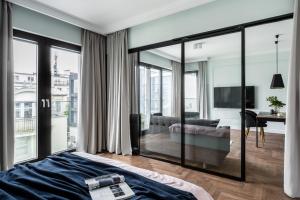 Posteľ alebo postele v izbe v ubytovaní Grand Apartments Wave- Na Fali