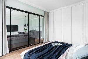 Posteľ alebo postele v izbe v ubytovaní Grand Apartments Wave- Na Fali