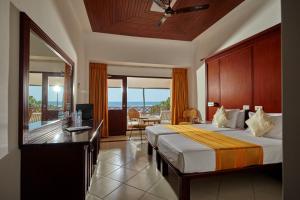 Letto o letti in una camera di Coral Sands Hotel