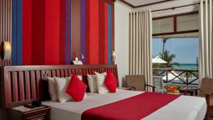 Letto o letti in una camera di Coral Sands Hotel