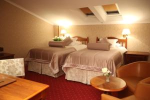 Postel nebo postele na pokoji v ubytování Grand Hotel & Spa Tirana