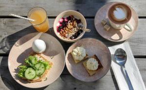 plates of food on a wooden table at Brobacka Gästhem in Jomala