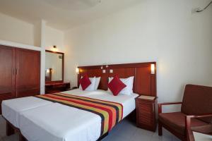 Letto o letti in una camera di Coral Sands Hotel