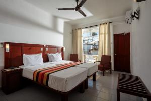 Letto o letti in una camera di Coral Sands Hotel