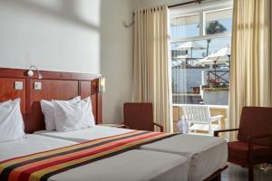 Letto o letti in una camera di Coral Sands Hotel
