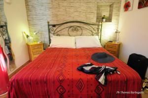 A bed or beds in a room at B&B Giuseppe Verdi