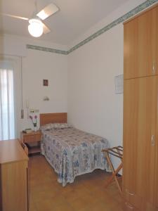 Postel nebo postele na pokoji v ubytování Hotel Liliana