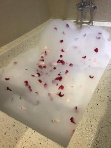 a white counter top with red hearts on it at Touch 星空包棟民宿寵物友善民宿 in Wujie