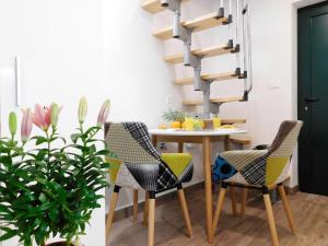 a dining room with a table and chairs at Studio apartment Milla in Split