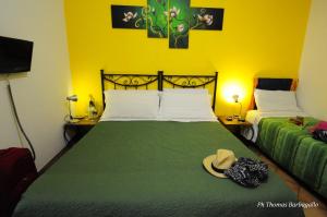 A bed or beds in a room at B&B Giuseppe Verdi