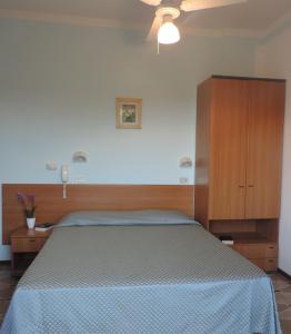 Postel nebo postele na pokoji v ubytování Hotel Liliana