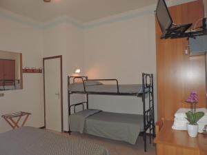 Postel nebo postele na pokoji v ubytování Hotel Liliana