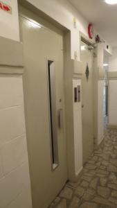 a hallway with a door leading to a bathroom at Atlântico Centro Apartments in Rio de Janeiro