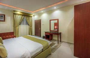 Postel nebo postele na pokoji v ubytování Nawara Dala