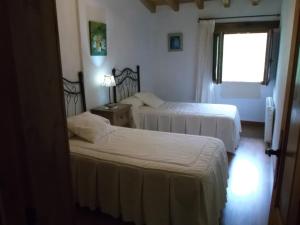 A bed or beds in a room at Apartamento San Mamés