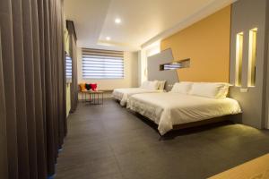 Krevet ili kreveti u jedinici u okviru objekta Qi Li Xiang Homestay