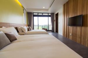 Krevet ili kreveti u jedinici u okviru objekta Qi Li Xiang Homestay