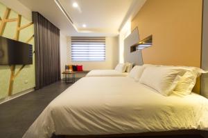 Krevet ili kreveti u jedinici u okviru objekta Qi Li Xiang Homestay