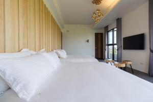 Krevet ili kreveti u jedinici u okviru objekta Qi Li Xiang Homestay