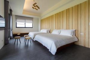 Krevet ili kreveti u jedinici u okviru objekta Qi Li Xiang Homestay