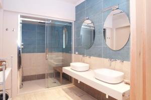 a bathroom with two sinks and a shower at La Casa di Anny camere di Charme in Diano Marina +20 photos