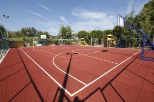 a tennis court with a net on top of it at Village Baia Turchese in Vieste