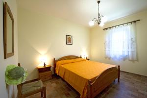 a bedroom with a bed and a window at Lido Camping Village in Bolsena