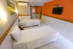 Uma TV ou centro de entretenimento em Inter Hotel
