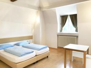 Postel nebo postele na pokoji v ubytování Manzoni Rooms