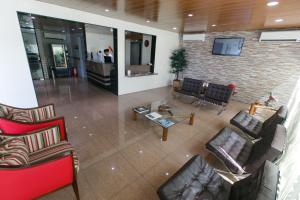 an overhead view of a living room with couches and chairs at Inter Hotel in Recife